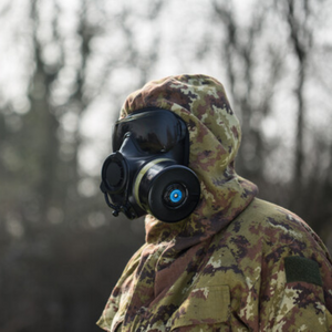 Person wearing an Avon Protection FM54 APR with camouflaged clothing 